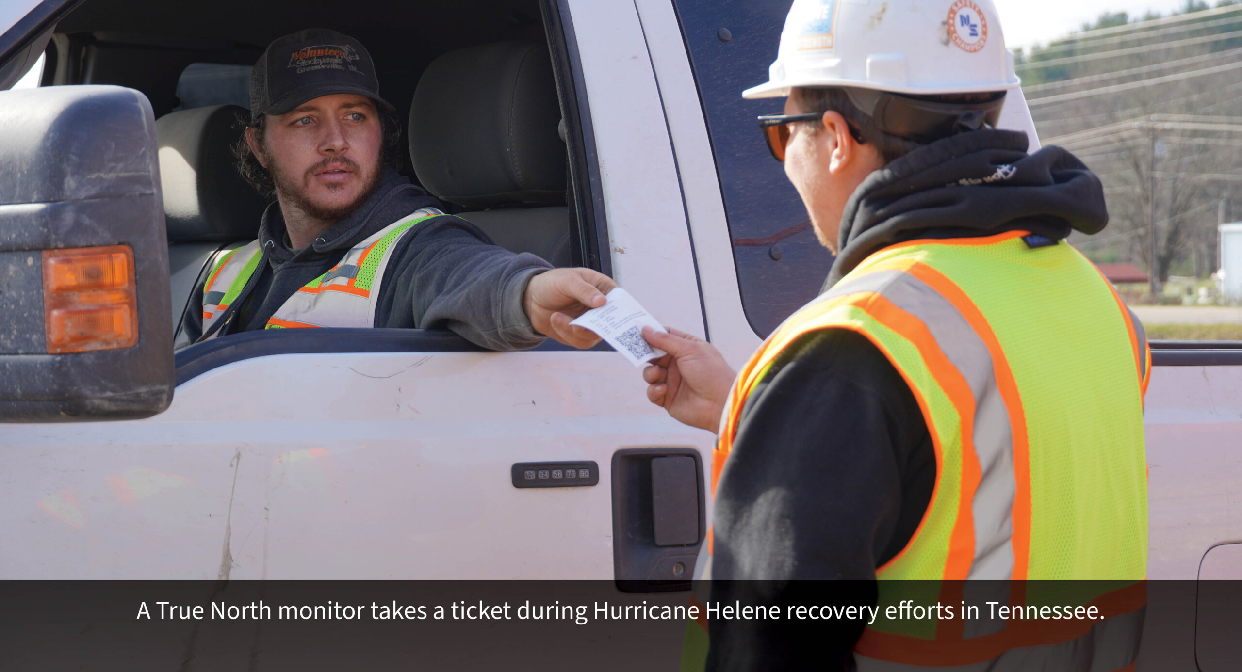 A True North monitor takes a ticket during Hurricane Helene recovery efforts in Tennessee.