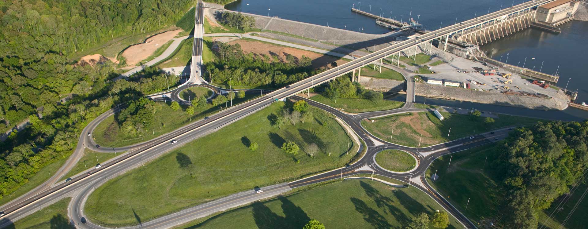 An aerial view of a roundabout just off the highway.