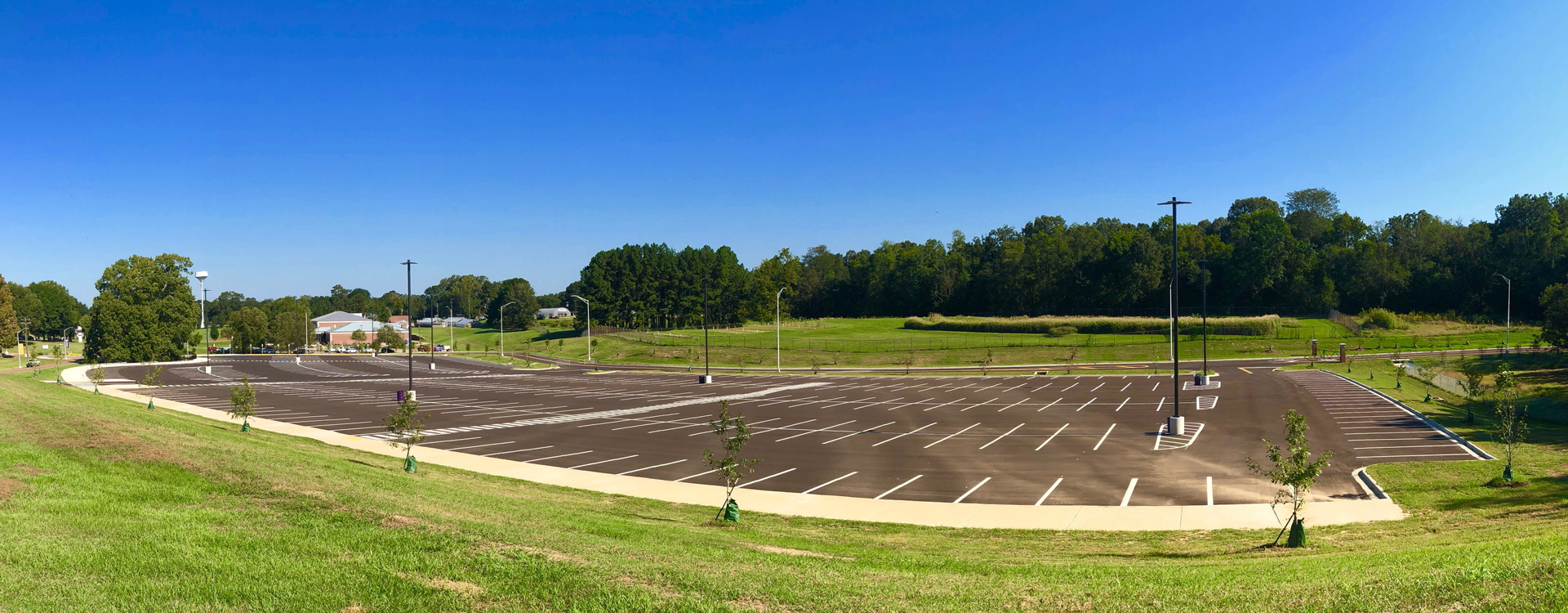 A view of the Alcorn State football stadium parking lot. It's surrounded by flat, grassy terrain.