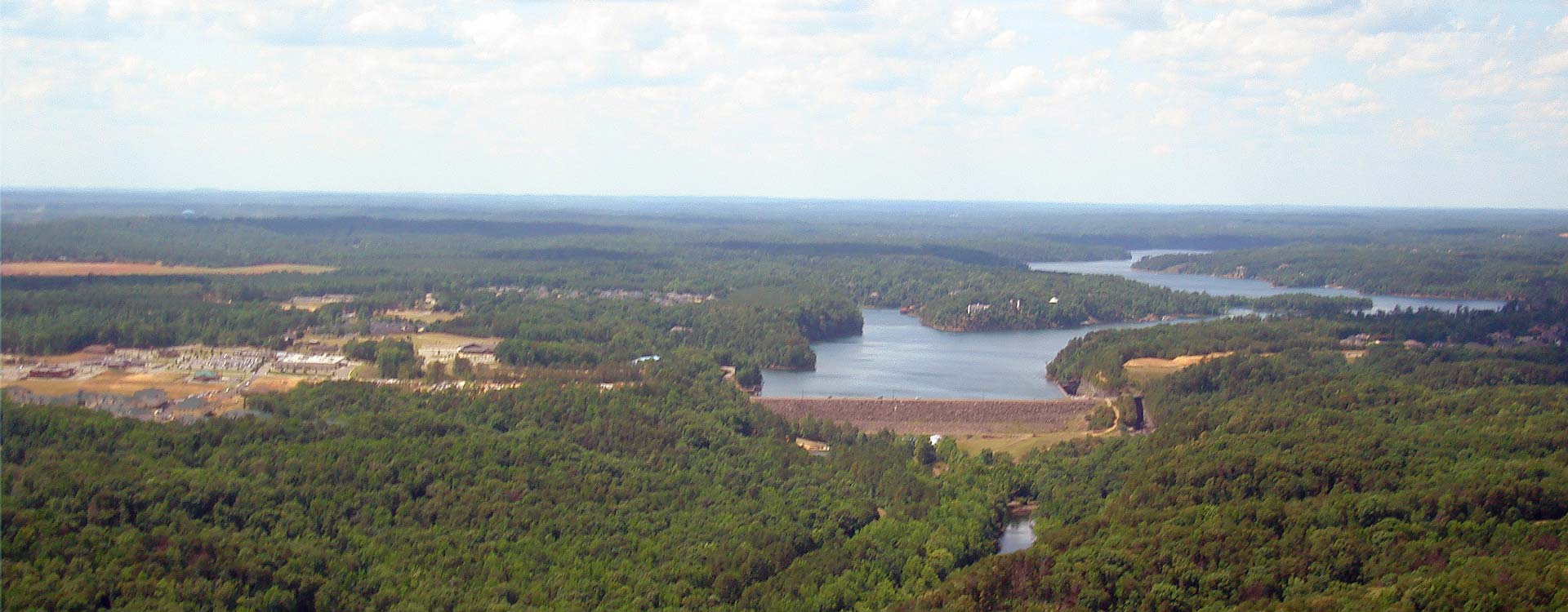 Aerial view of Lake Tuscaloosa surrounded by trees.