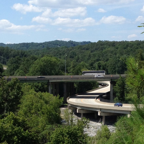 A view of the highway through trees.
