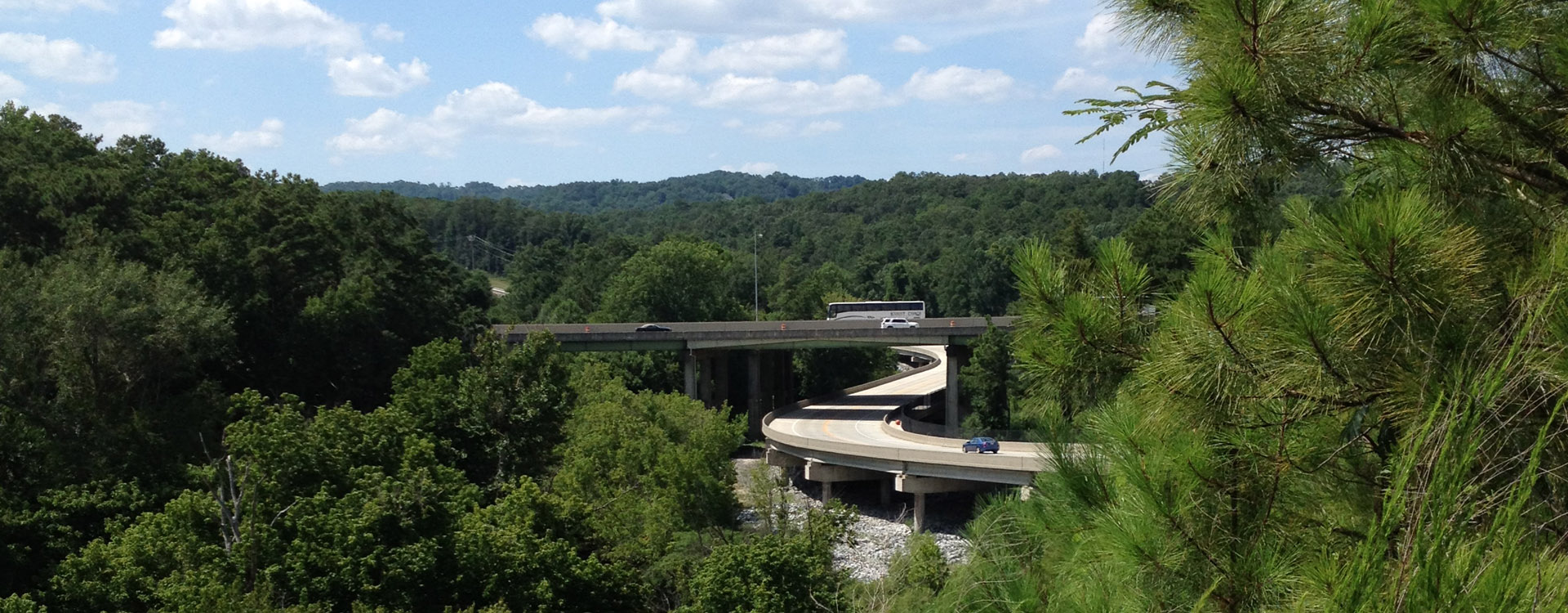 A view of the highway through trees.